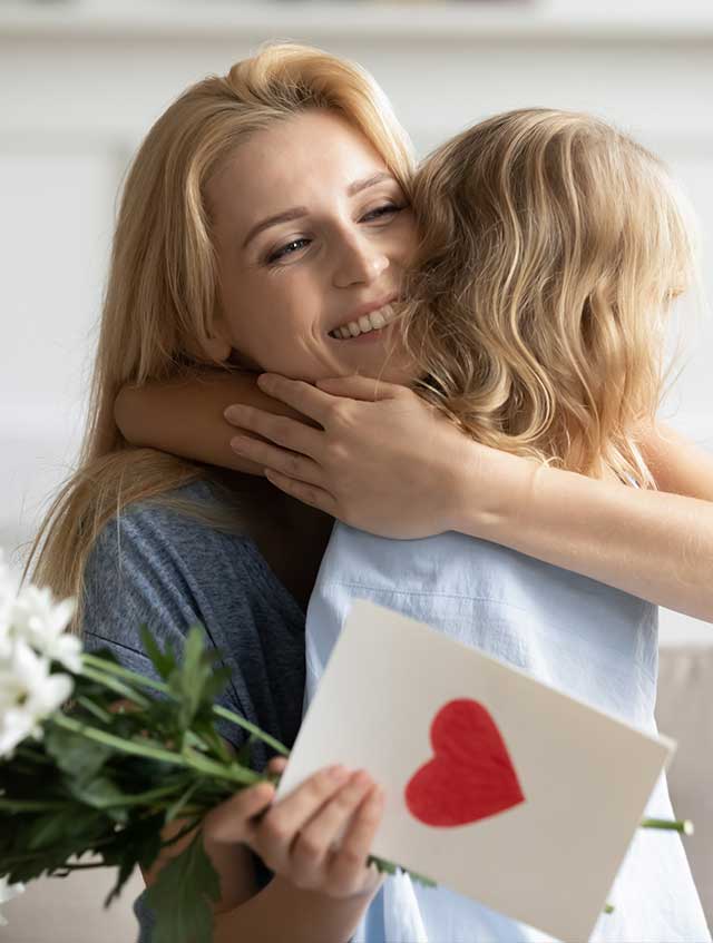 Mother hugging child